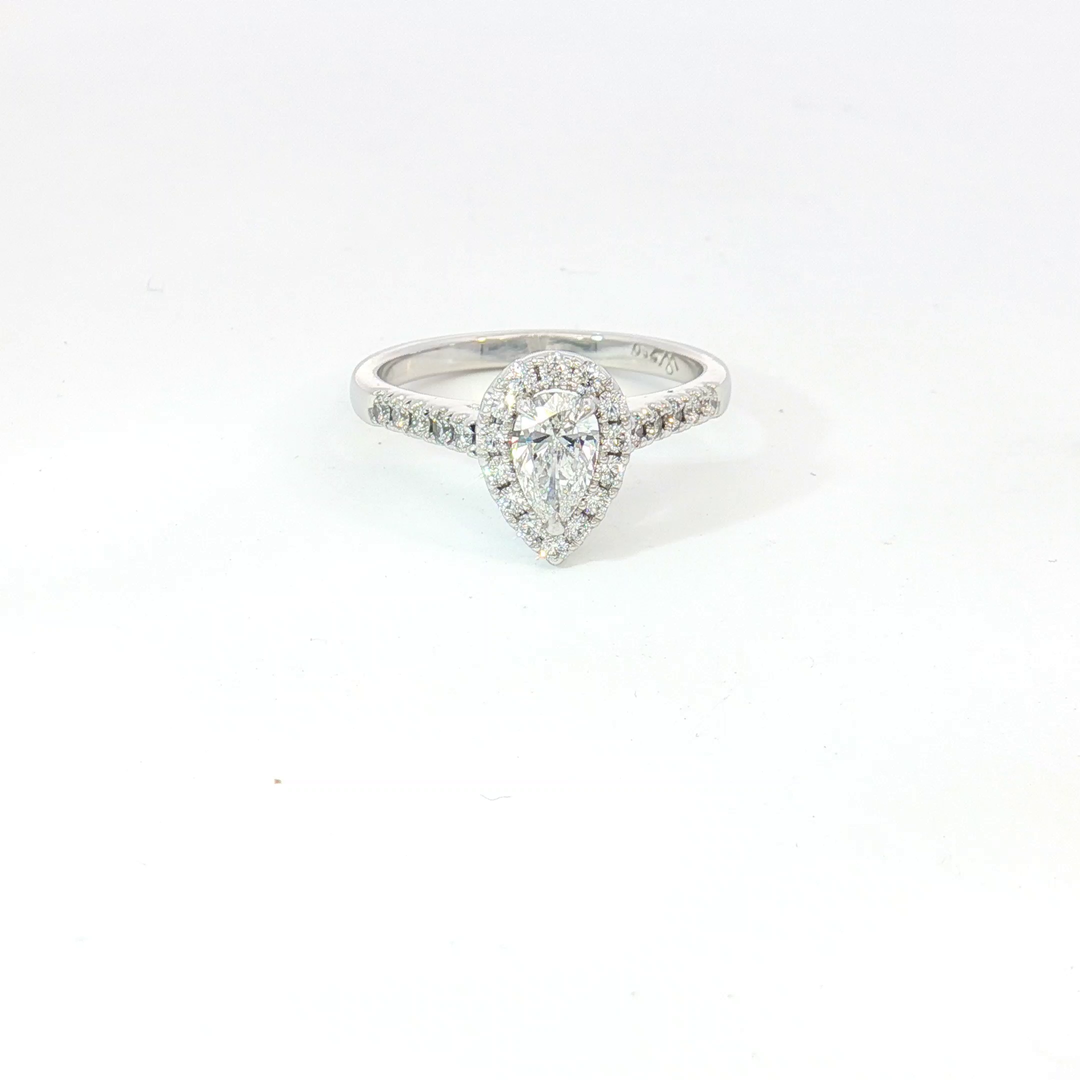 18ct White Gold pear cut diamond and RBC halo Ring.