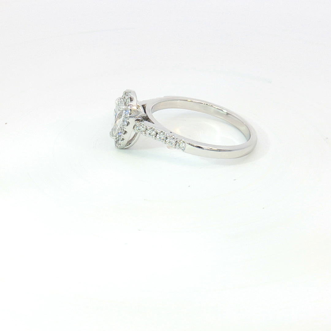 18ct White Gold pear cut diamond and RBC halo Ring.