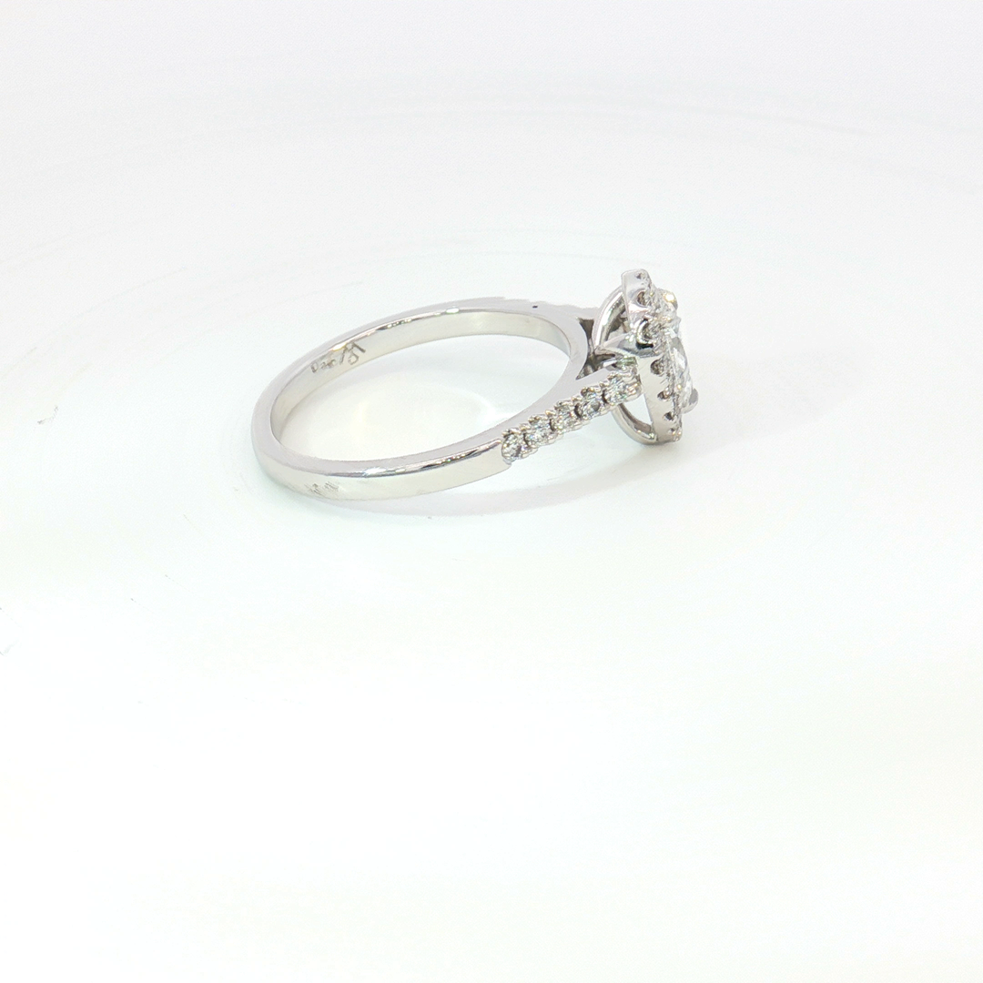 18ct White Gold pear cut diamond and RBC halo Ring.