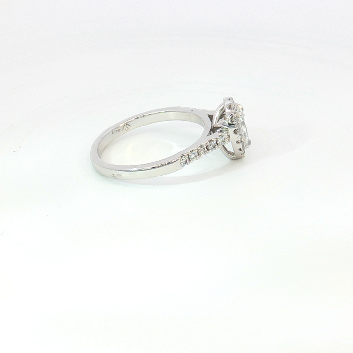 18ct White Gold pear cut diamond and RBC halo Ring.