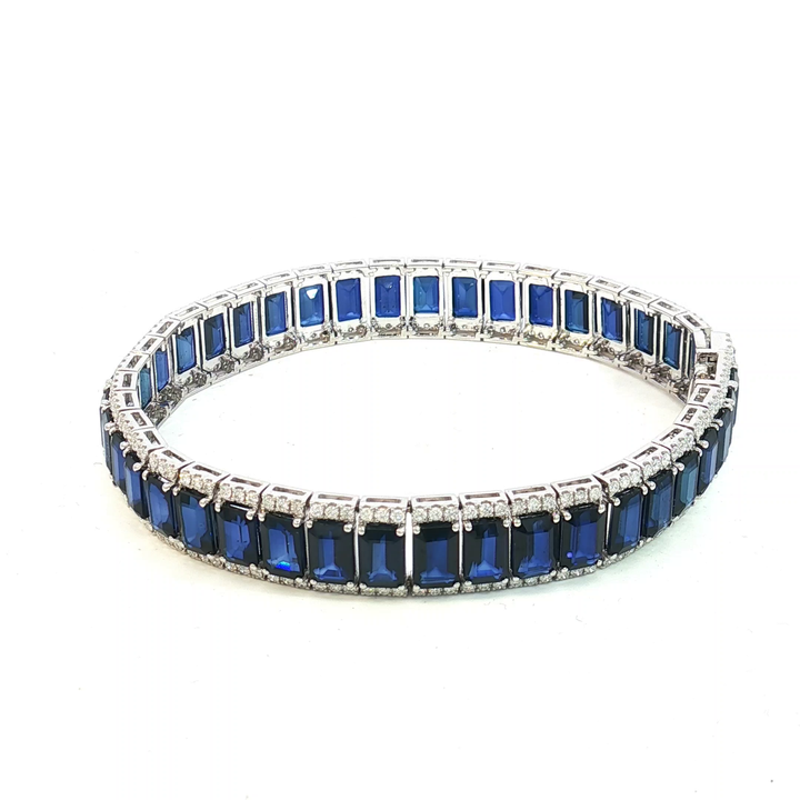 18ct White Gold Tennis Bracelet with Deep Blue Emerald Cut Sapphires