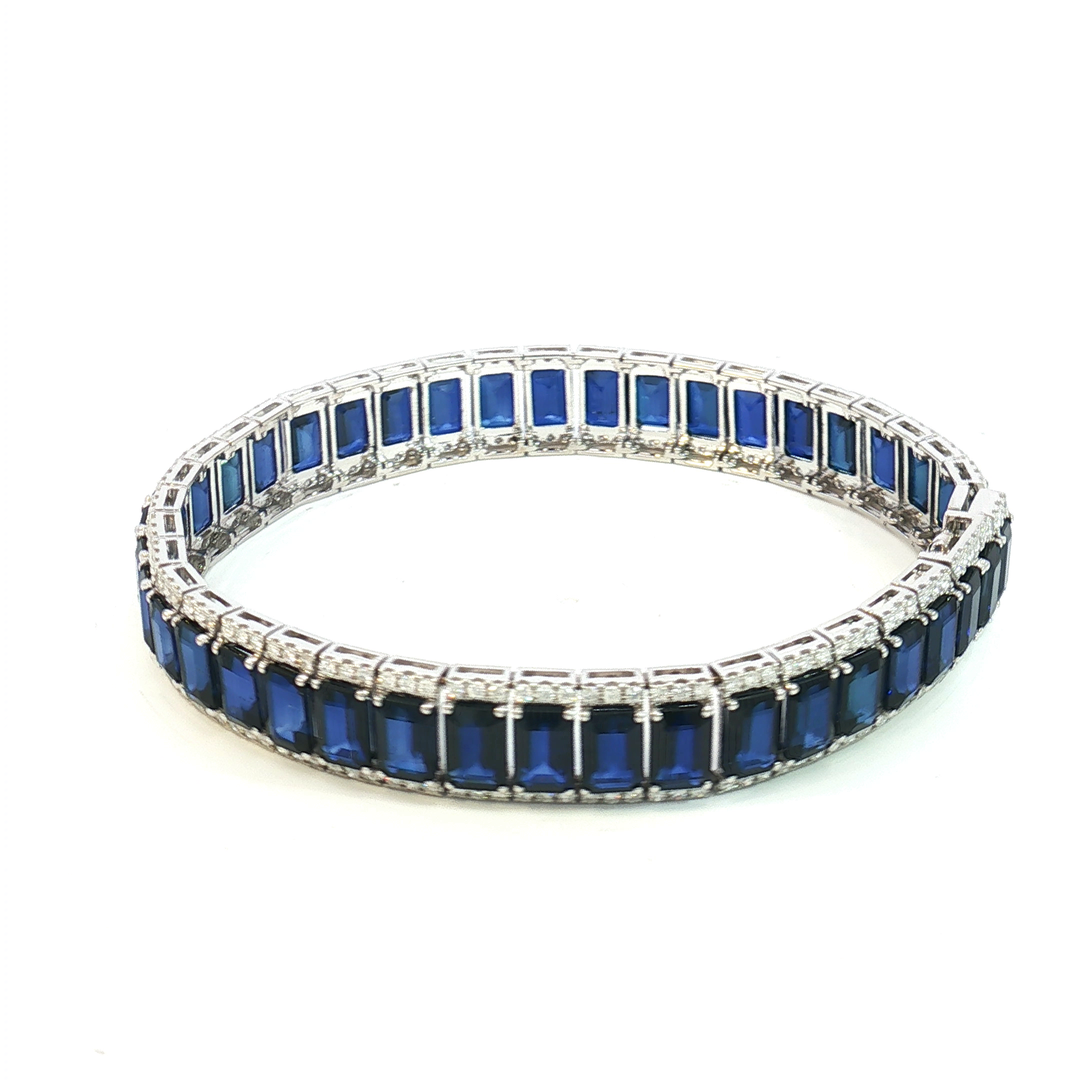 18ct White Gold Tennis Bracelet with Deep Blue Emerald Cut Sapphires