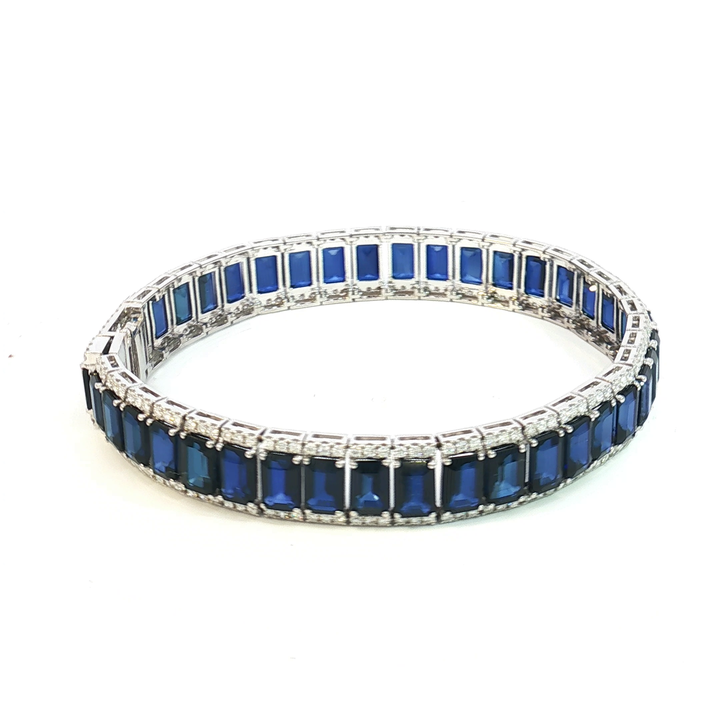 18ct White Gold Tennis Bracelet with Deep Blue Emerald Cut Sapphires