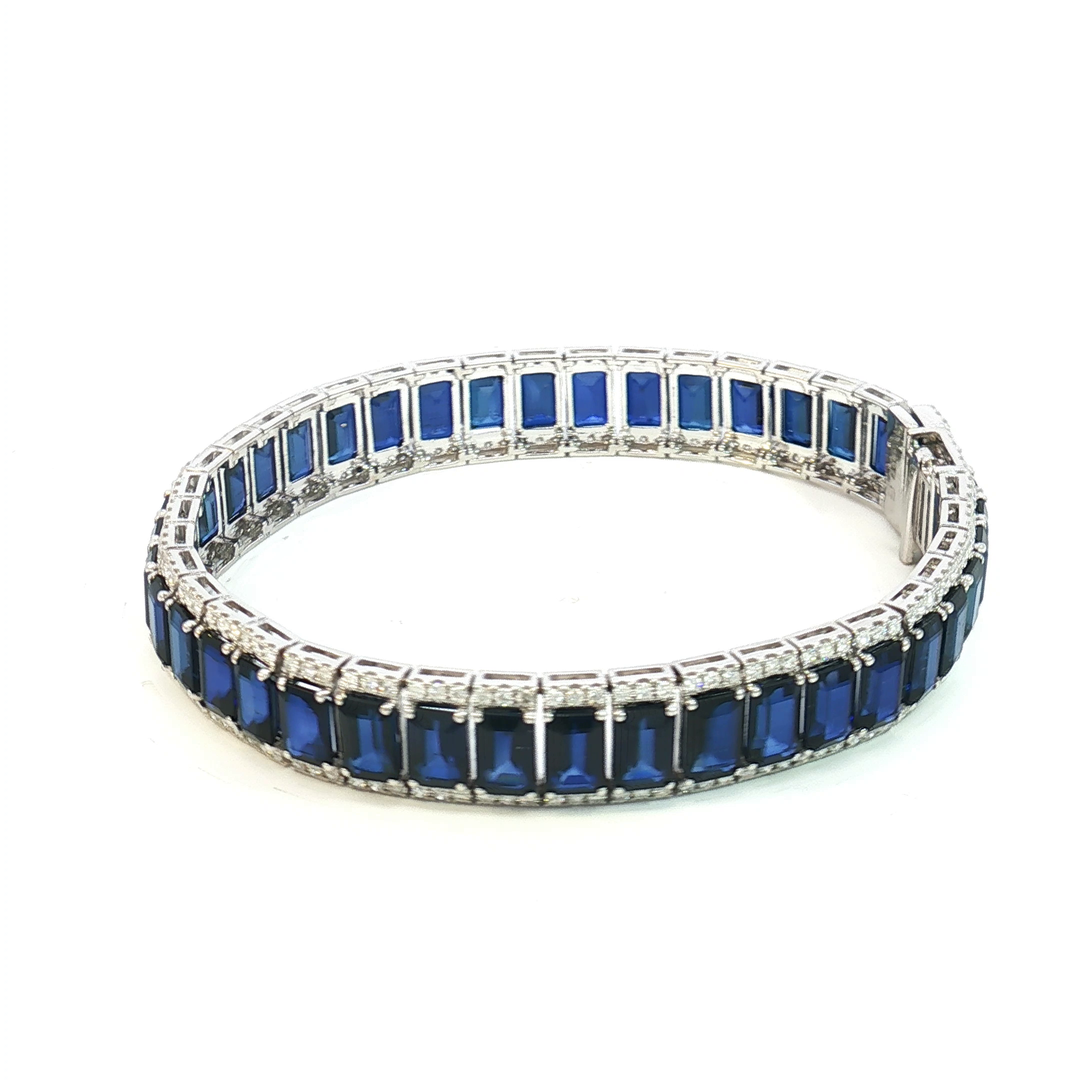 18ct White Gold Tennis Bracelet with Deep Blue Emerald Cut Sapphires
