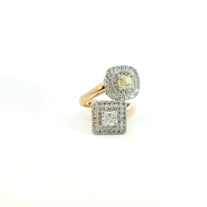 18ct yellow and white gold double cluster offset ring with a radiant cut white diamond and cushion cut yellow diamond