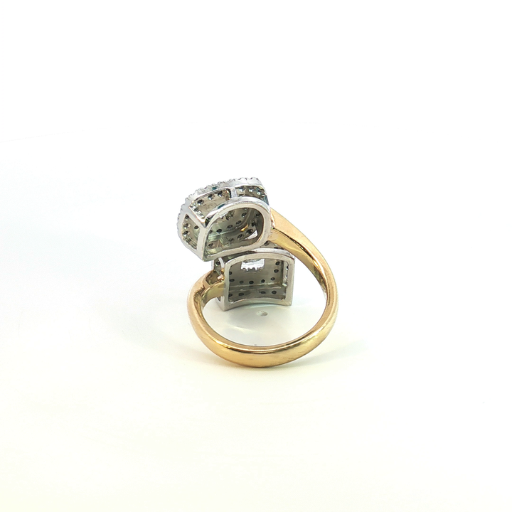 18ct yellow and white gold double cluster offset ring with a radiant cut white diamond and cushion cut yellow diamond