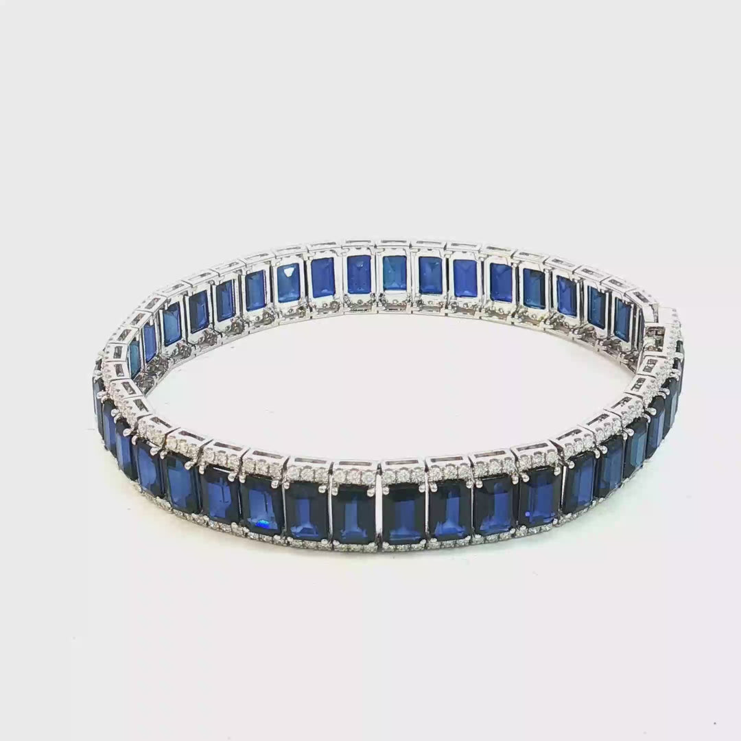 18ct White Gold Tennis Bracelet with Deep Blue Emerald Cut Sapphires