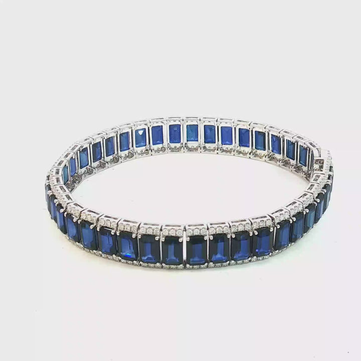 18ct White Gold Tennis Bracelet with Deep Blue Emerald Cut Sapphires