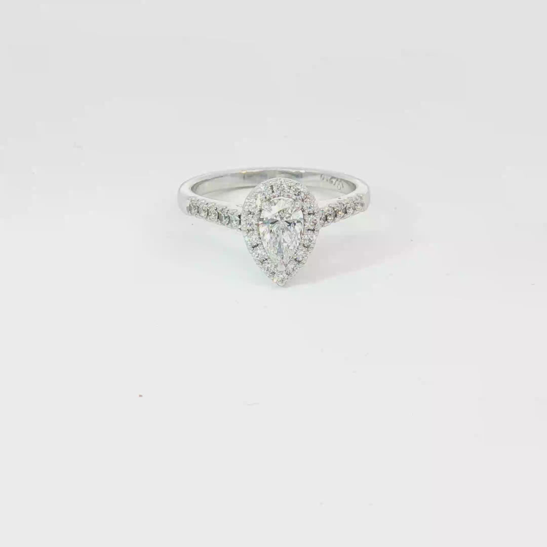 18ct White Gold pear cut diamond and RBC halo Ring.
